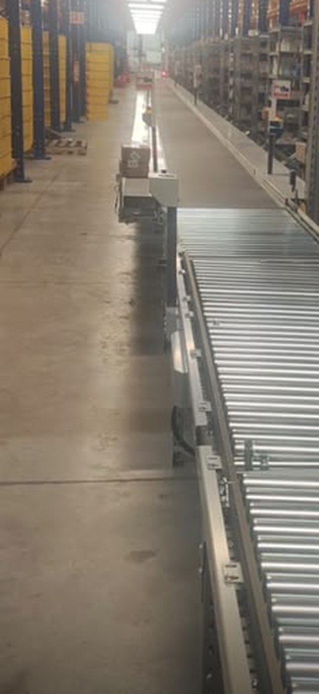 A warehouse aisle, photographed on a phone